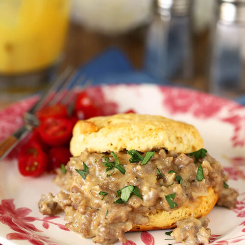 White and Pink Plate with Biscuits with Sausage and Maple Flavor White Gravy