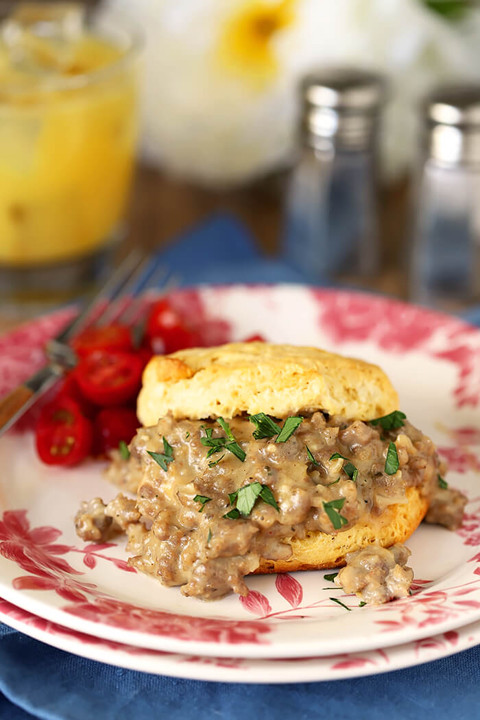 White and Pink Plate with Biscuits with Sausage and Maple Flavor White Gravy