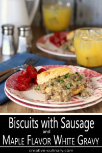 Table set with Servings of Biscuits with Sausage and Maple Flavor White Gravy and OJ