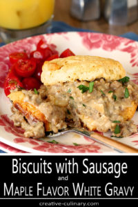 Serving of Biscuits with Sausage and Maple Flavor White Gravy on White Plate with Pink Flowers