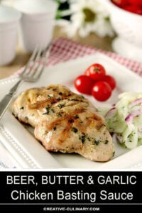 Beer, Butter, and Garlic Chicken Basting Sauce on Chicken Thighs Garnished with Herbs Served with Cherry Tomatoes