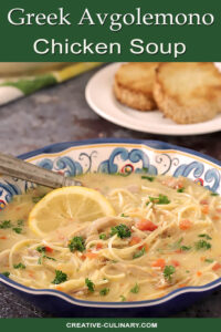 Bowl of Overhead of Greek Avgolemono Soup with Chicken and Lemon Soup Garnished with Parsley