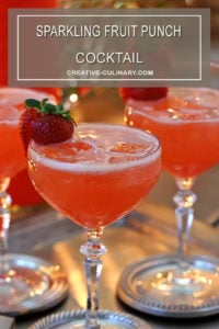 Sparkling Fruit Punch Champagne Cocktail Garnished with Fresh Strawberry