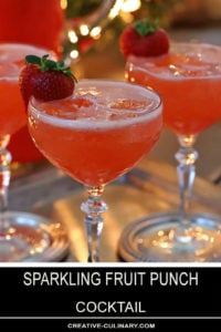 Sparkling Fruit Punch Champagne Cocktail Garnished with Fresh Strawberry