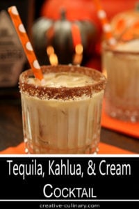 Tequila, Kahlua, and Cream Cocktail in a Highball Glass with an Orange Straw