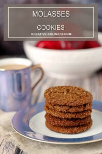 Molasses Cookies on a Blue and White Plate with Apples in the Background