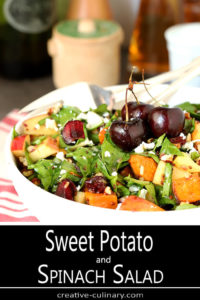 Sweet Potato and Spinach Salad with Pecans, Cherries and Goat Cheese Garnished with Whole Cherries