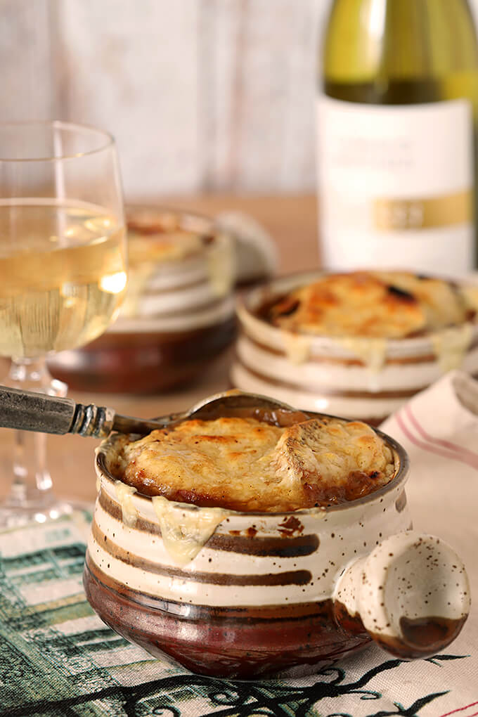 The UItimate French Onion Soup in Table Setting with Three Soups Bowls