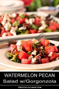 Watermelon Pecan Salad with Gorgonzola Cheese Served on a Round White Plate