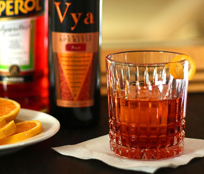 Aperol Negroni Cocktail Served on a Napkin with LemonTwist