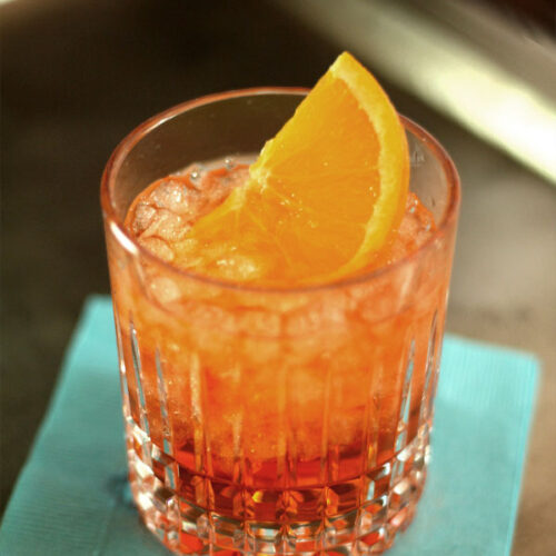 Closeup of Aperol Spritz with Orange Slice Garnish