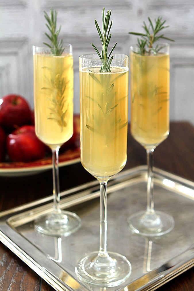 Apple Cider Bellini Cocktail with Rosemary Cocktail Served on a Silver Tray