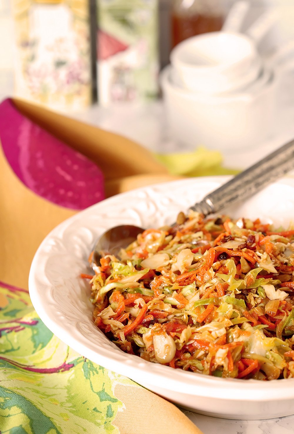 Crispy Asian Slaw with Almonds is Served in a large white bowl.