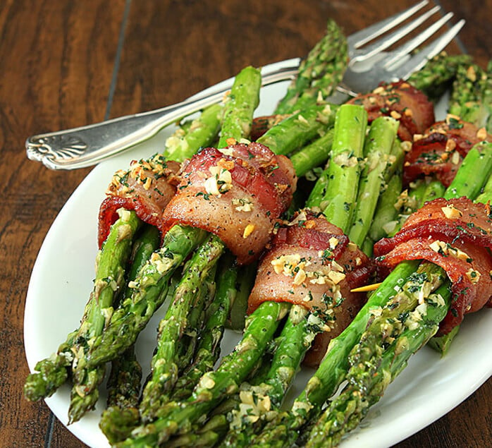 Bacon Wrapped Asparagus with Garlic on a White Serving Plate