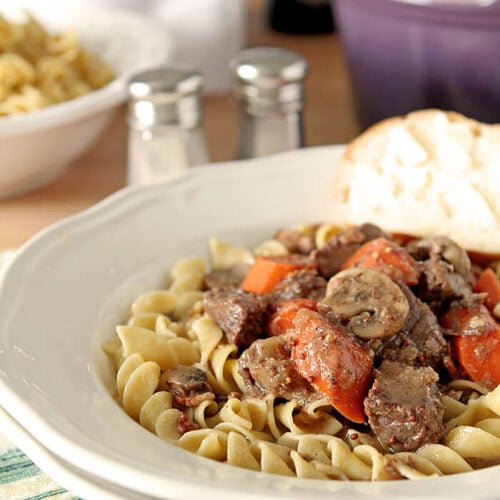 Beef Stew with Cognac and Mustard Served in a White Bowl