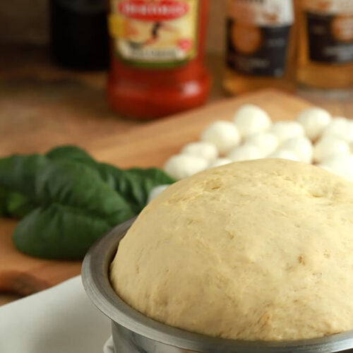 15 Minute Beer Pizza Dough Rising in a Stainless Steel Bowl