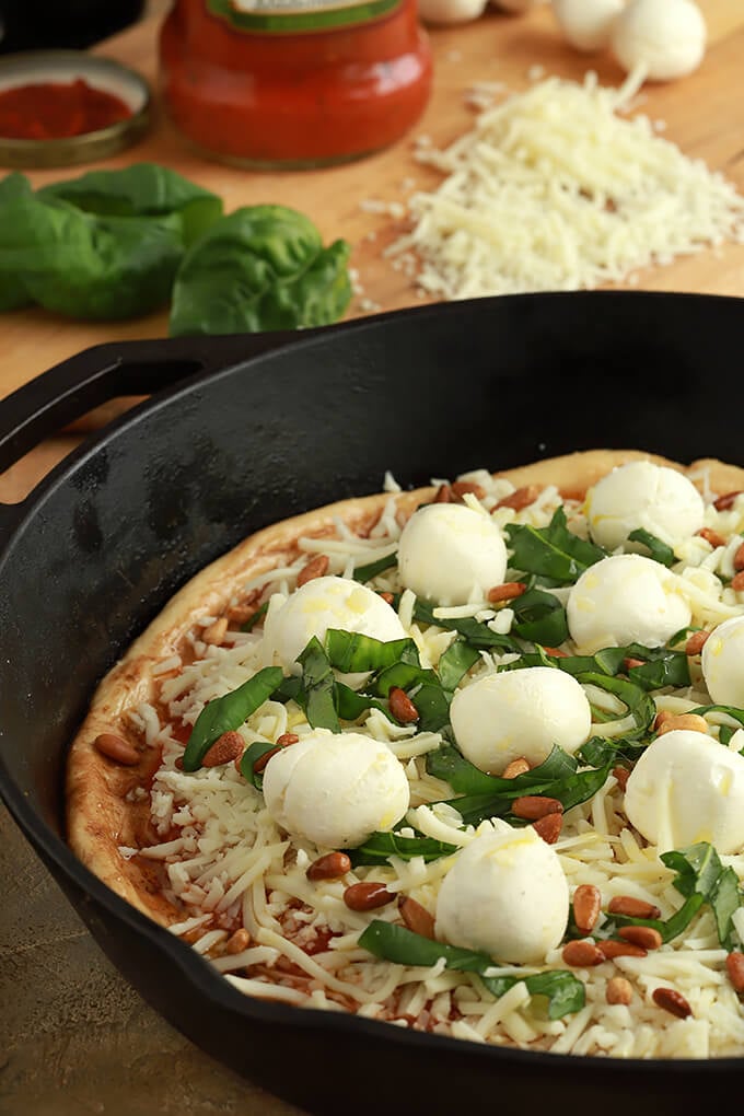 15 Minute Beer Pizza Dough With Tomato Sauce, Cheese and Herbs in a Cast Iron Skillet