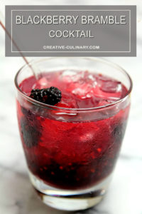 Blackberry Bramble Cocktail in Lowball Glass and Garnished with Blackberries