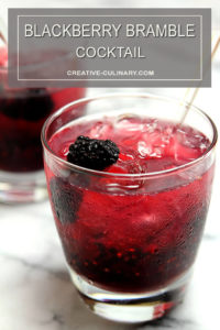 Blackberry Bramble Cocktail in Lowball Glass and Garnished with a Whole Blackberry