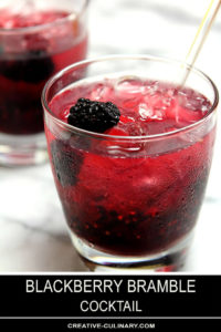 Blackberry Bramble Cocktail in Lowball Glass and Garnished with Blackberries