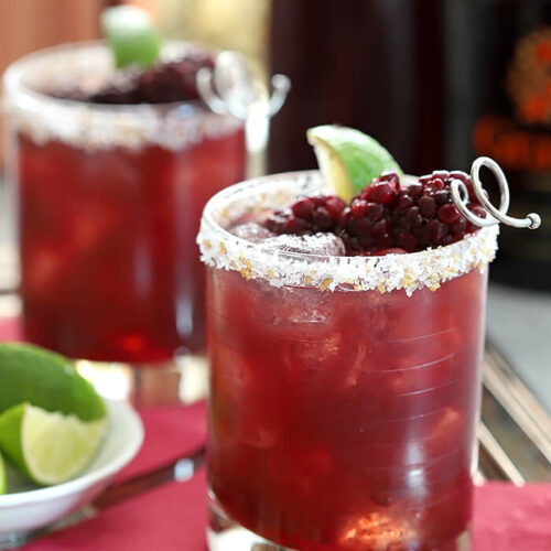 Blackberry Serrano Margarita Cocktails with Lime Wedge and Blackberry Garnish