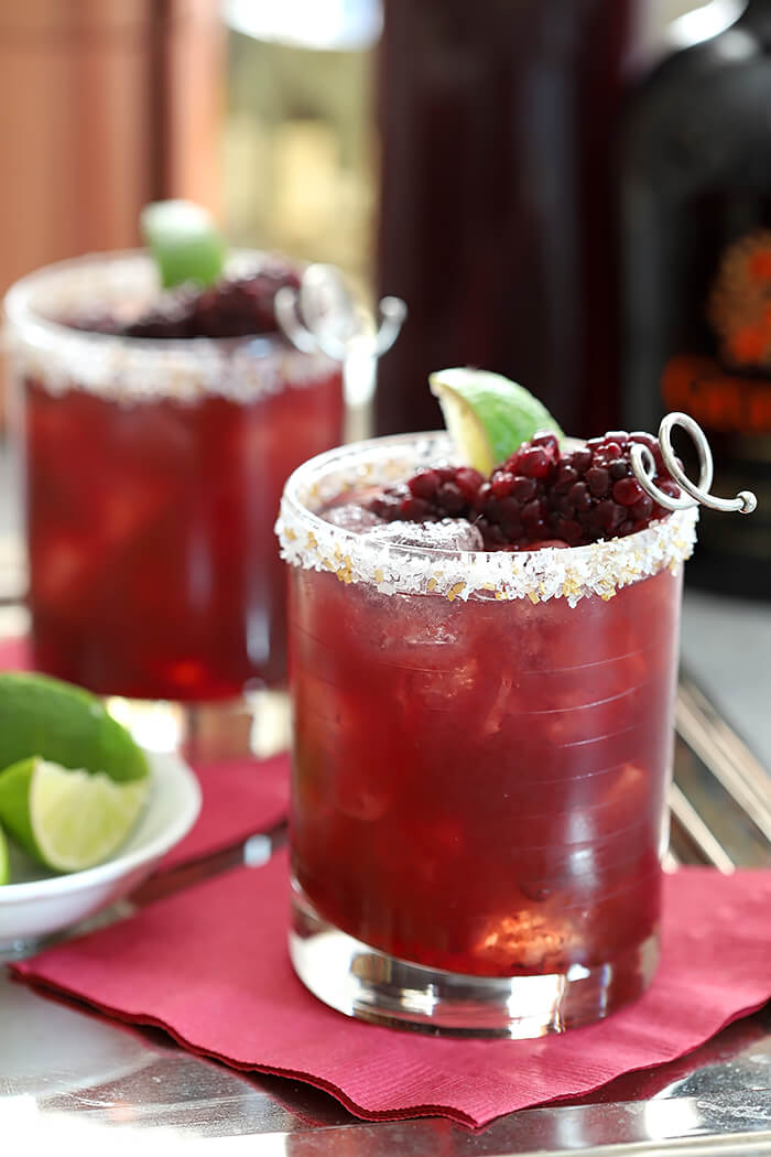 Blackberry Serrano Margarita Cocktails with Lime Wedge and Blackberry Garnish