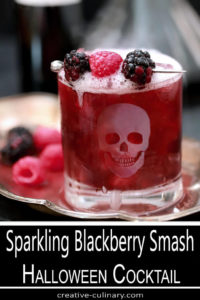 Sparkling Blackberry Smash Cocktail in Highball Glass with Etched Skull