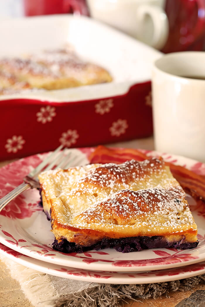 Slice of Blueberry Cream Cheese Croissant Bake White and Rose Plate