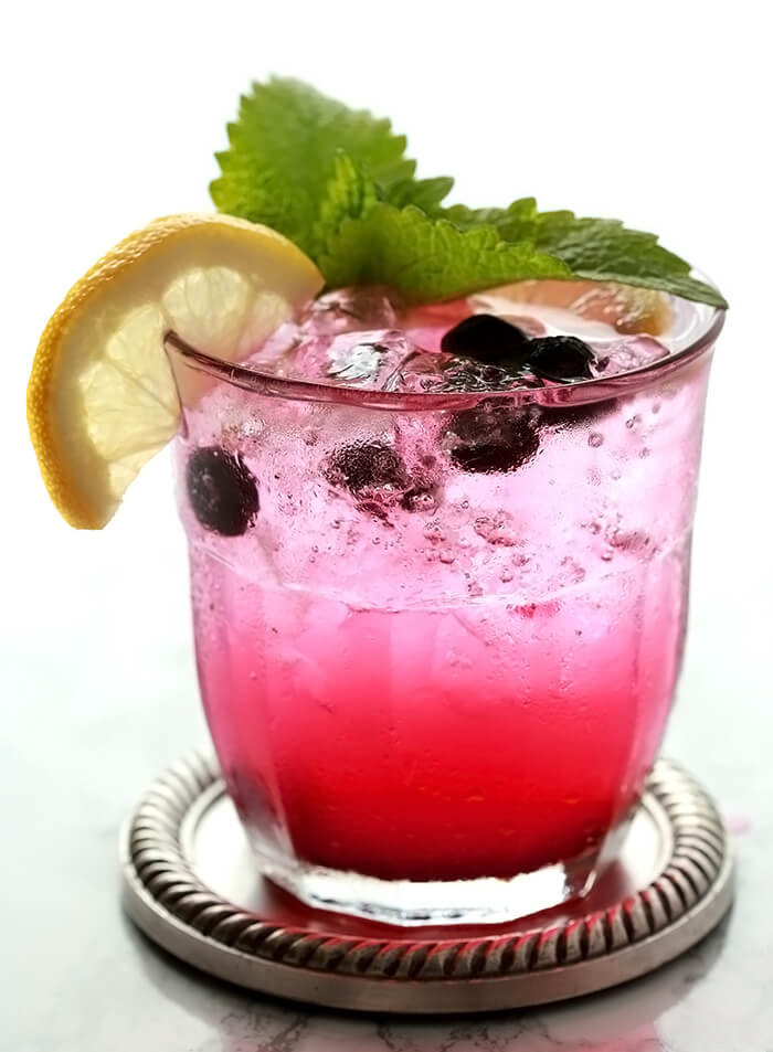 Closeup of a single Sparkling Lemonade and Blueberry Cocktail