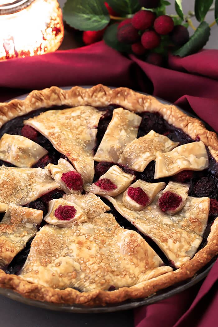 This Halloween Booberry Pie has Mixed Berries and a Design on Top with Pastry That Looks Like Fingers Grasping From Below