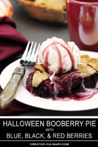 A Slice of Booberry (Mixed Berry Pie) with Vanilla Ice Cream on Top Drizzled with Pomegranate Syrup