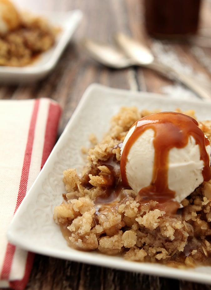 Boozy Apple Crisp Served ala Mode on a White Plate