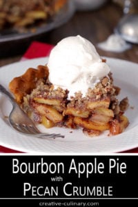 Bourbon Caramel Apple Pie with Pecan Crumble on a White Plate with Vanilla Ice Cream