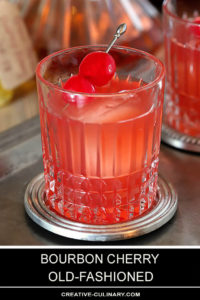 Bourbon Cherry Old Fashioned Cocktail Closeup with Cherries in Glass