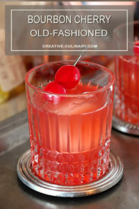 Bourbon Cherry Old Fashioned Cocktail Closeup with Cherries in Glass