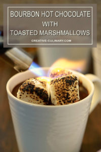 Bourbon Hot Chocolate with Toasted Marshmallow in a Cup Being Torched