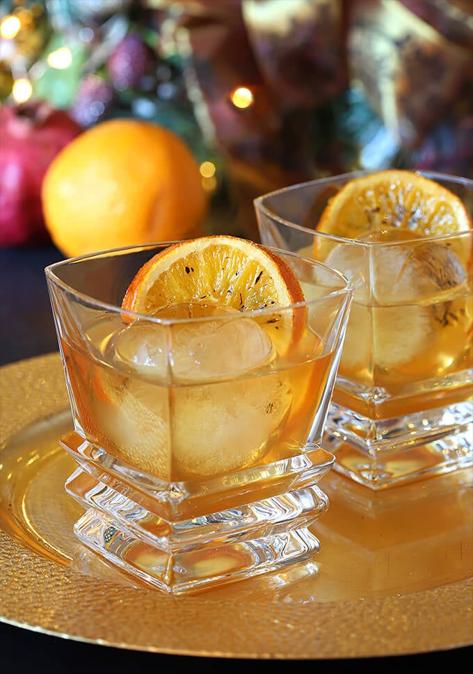 Bourbon and Orange Brulee Cocktail Served on a Gold Charger