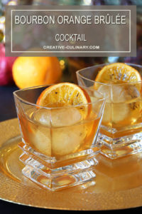 Two Bourbon Orange Brûlée Cocktails on Gold Serving Tray