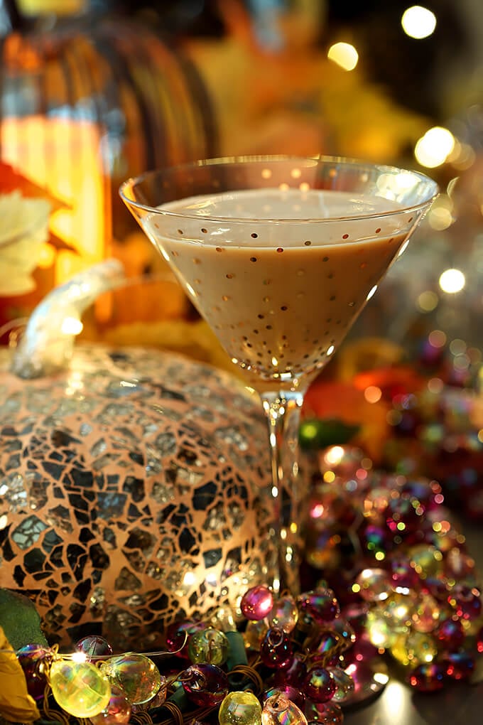 Bourbon Pumpkin Cocktail with Chocolate Liqueur Served in a Martini Glass with Gold Polk-a-dots