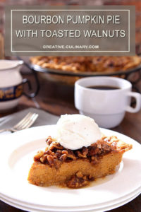 Slice of Bourbon Pumpkin Pie with Toasted Walnuts Topped with Whipped Cream