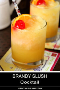 Brandy Slush Cocktails Garnished with Orange Slice and Maraschino Cherry