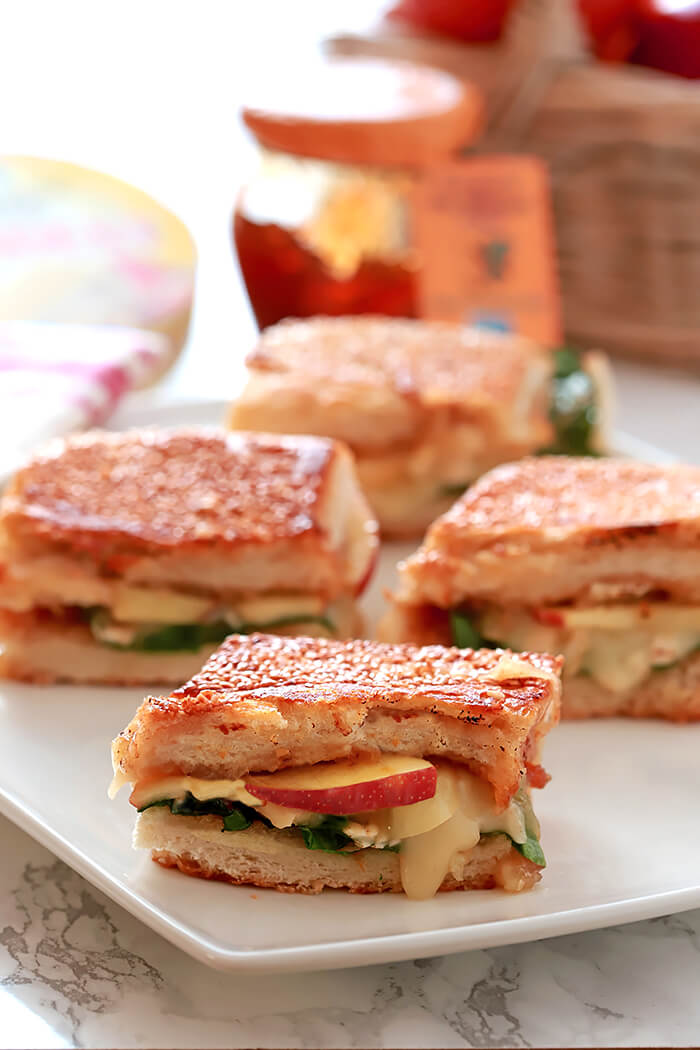 Bried, Apple, and Fig Grilled Cheese Sandwiches on a Rectangular Serving Plate