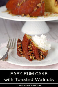 Slice of Easy Rum Cake with Butter Rum Glaze and Whipped Cream