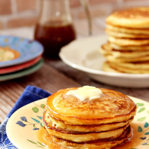 Stack of The BEST Buttermilk Pancakes with Butter and Syrup