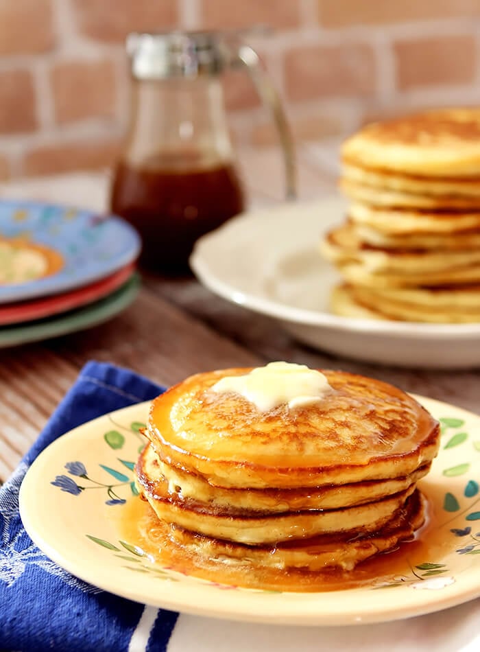 Stack of The BEST Buttermilk Pancakes with Butter and Syrup