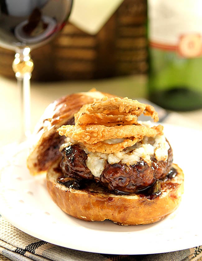 Lamb Burger with Goat Cheese and Onion Rings topped with a Cabernet BBQ Sauce