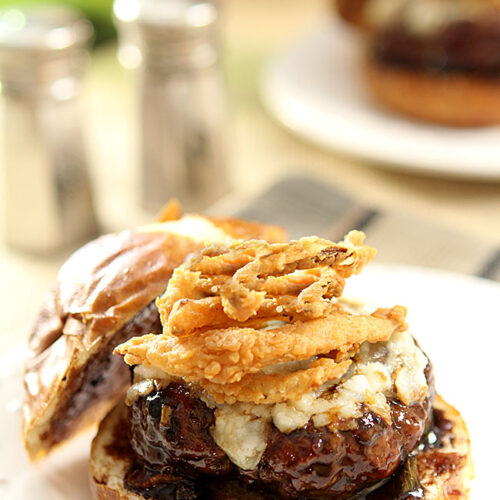 Lamb Burger with Goat Cheese and Onion Rings topped with a Cabernet BBQ Sauce