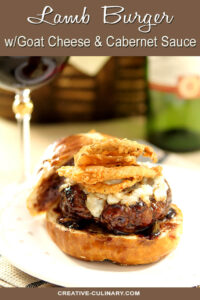 Lamb Burger with Goat Cheese and Cabernet Wine Sauce Topped with Fried Onion Rings