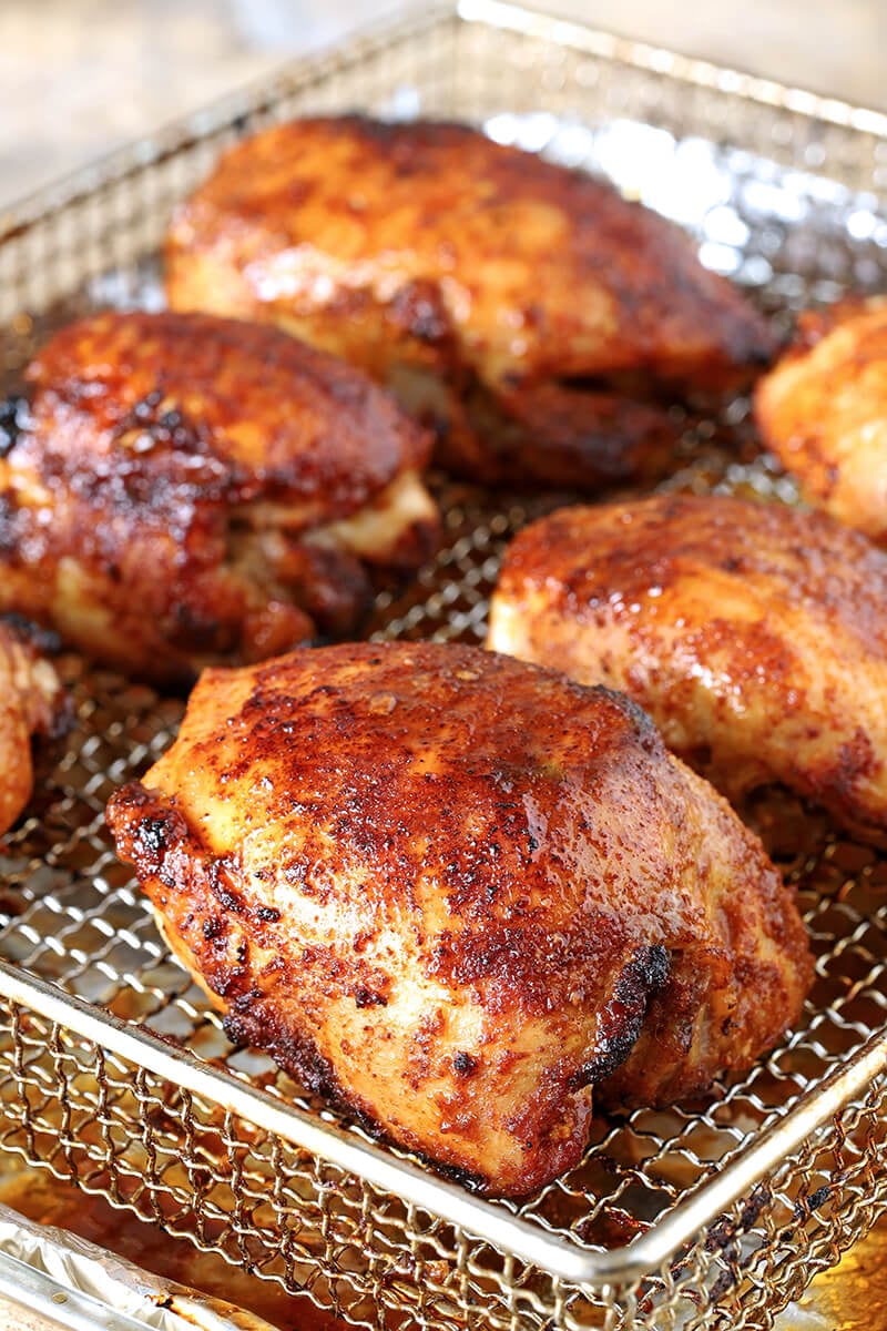 Air Fryer Chicken Thighs with Brown Sugar and Spices On Oven Fryer Tray with Beautiful Brown Color