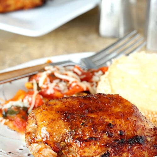 Air Fryer Chicken Thighs with Brown Sugar and Spices Served on a White Plate with Pasta